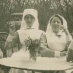 Nurses during a break sitting around a table